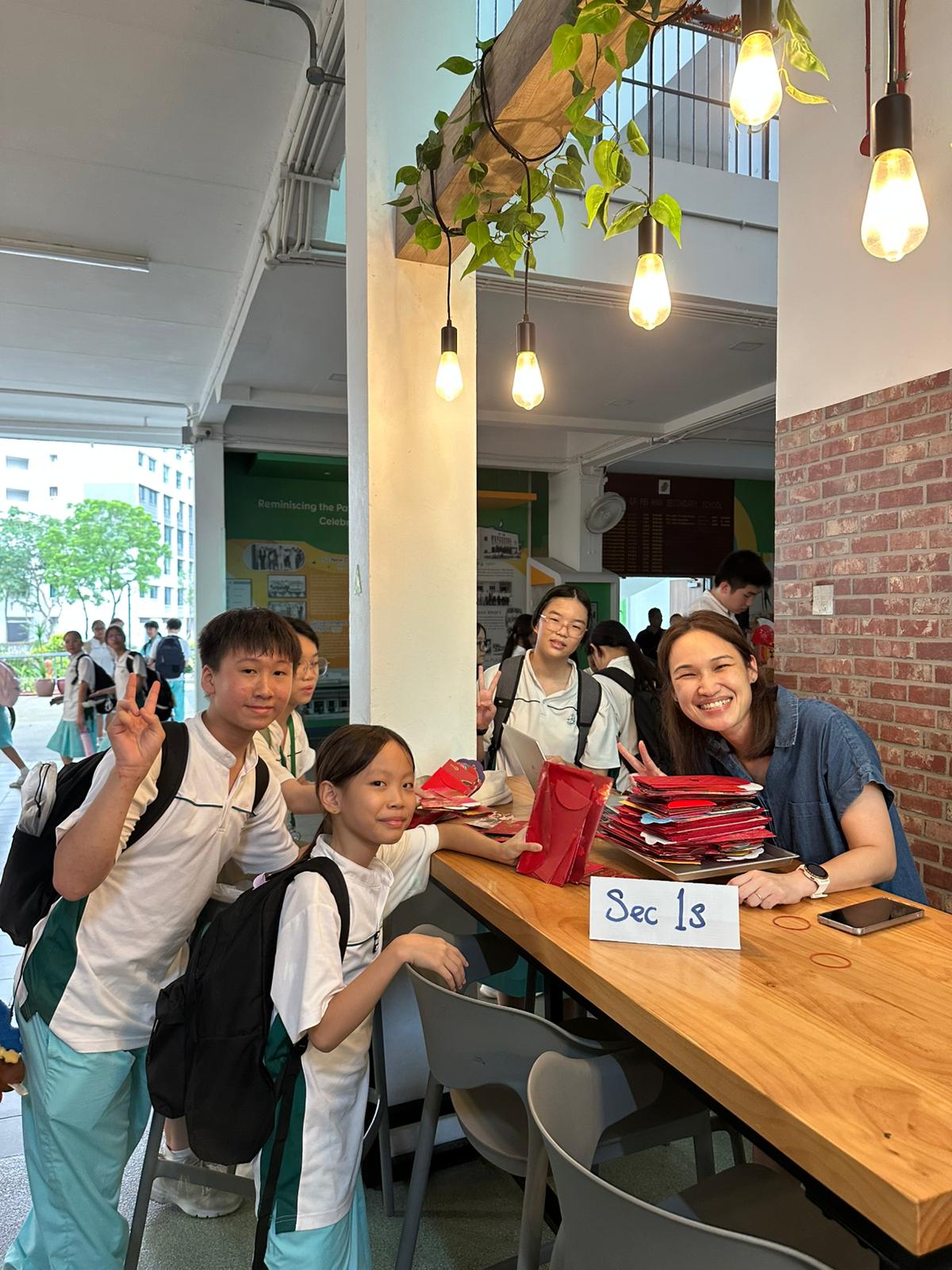 Pei Hwa Secondary School (1st in 2026 Secondary School Competition) participates in Recycle Red! by The Bettering Branch - Students depositing red packets into Recycle Red! by The Bettering Branch collection bins at school 