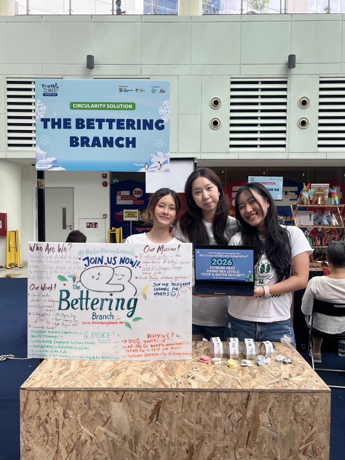 The Bettering Branch Team Raean Cheong, Carissa Sim and Belinda Koh spreading awareness to the public about the 2026 Year of Climate Adaptation.